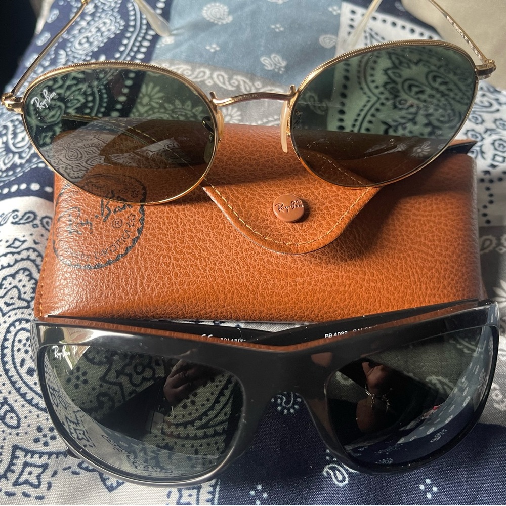 2 pair of Ray-Ban sunglasses and Ray-Ban case with dust cloth.